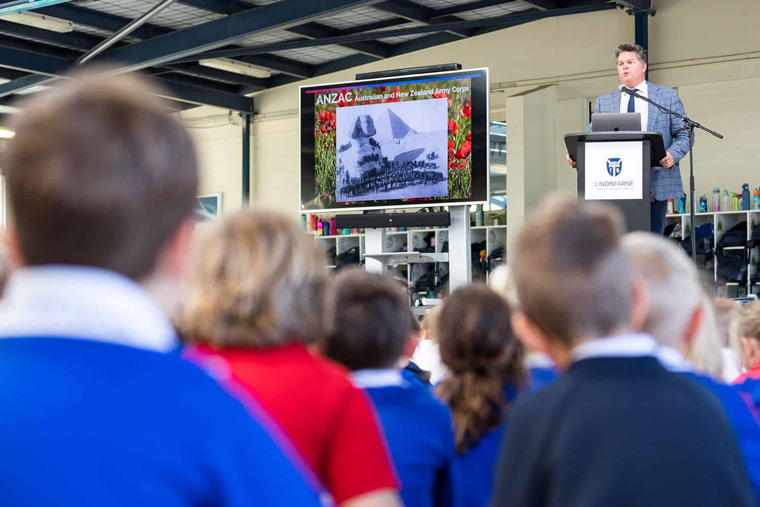 Junior School principal Mark Douglas speaks to the students about the importance of ANZAC Day